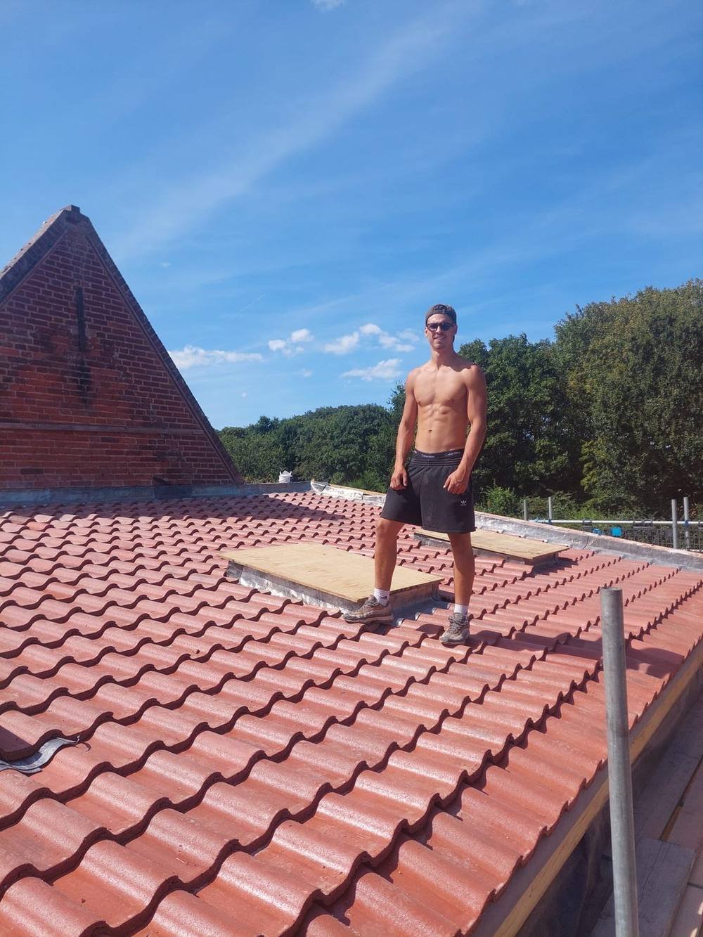 Rise Roofing team member on a re-roof