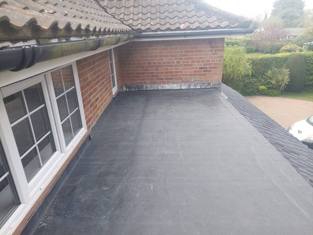 Conservatory roof and flat roof extension